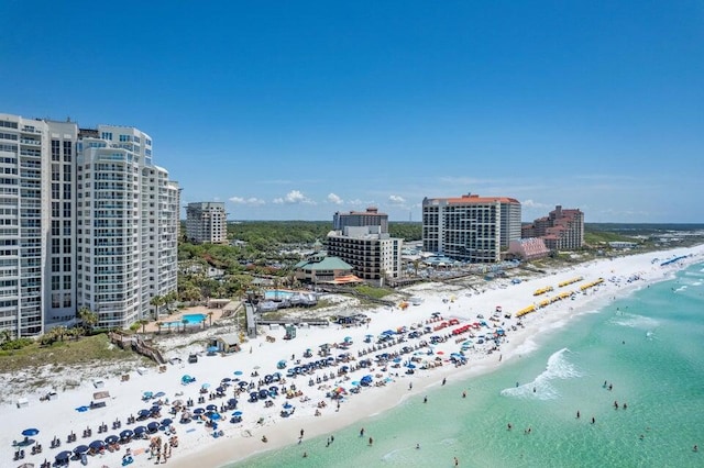 bird's eye view featuring a water view and a beach view