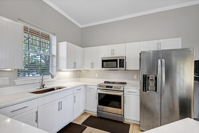 kitchen featuring white cabinets, sink, light tile patterned floors, light stone counters, and stainless steel appliances