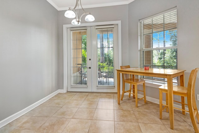 interior space with a chandelier, light tile patterned flooring, crown molding, and french doors