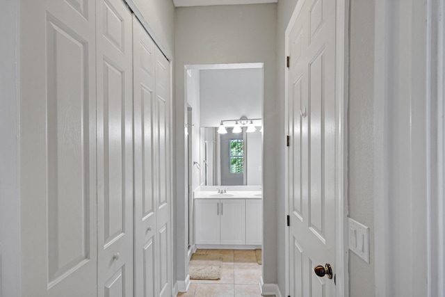 bathroom with tile patterned flooring and vanity