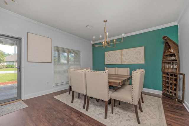 dining space with dark hardwood / wood-style floors, ornamental molding, and a wealth of natural light