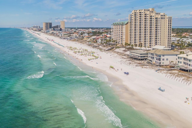 bird's eye view featuring a view of the beach and a water view