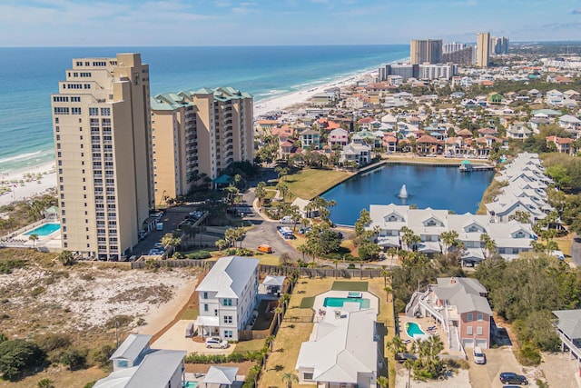 birds eye view of property featuring a water view and a view of the beach