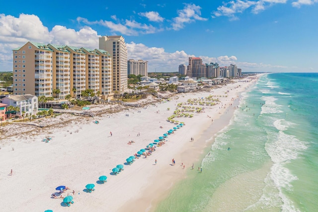 aerial view with a water view and a beach view