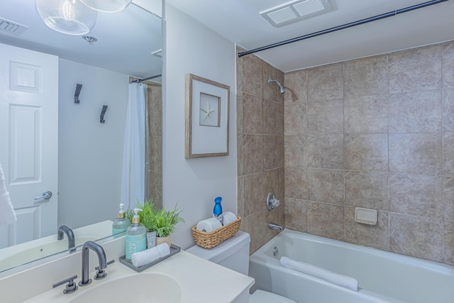 full bathroom with vanity, shower / bathtub combination with curtain, and toilet