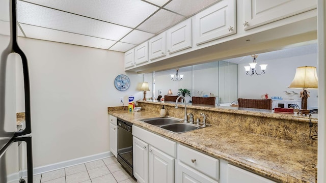 kitchen featuring dishwasher, sink, a paneled ceiling, and white cabinets