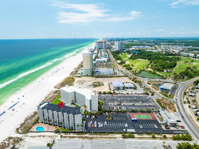 drone / aerial view featuring a view of the beach and a water view