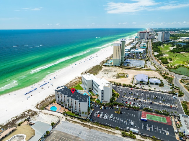 bird's eye view with a water view and a beach view