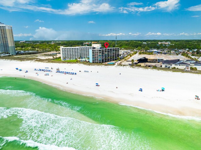 drone / aerial view with a beach view and a water view