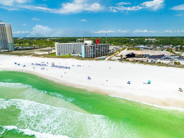 aerial view with a water view and a beach view