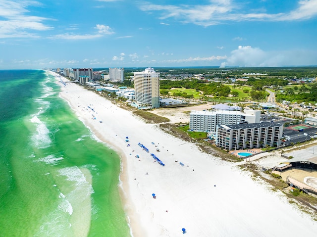 birds eye view of property with a view of the beach and a water view