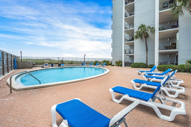 view of swimming pool with a patio