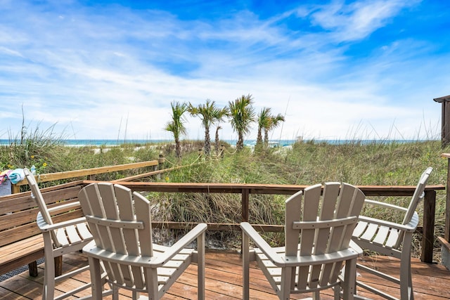 wooden deck featuring a water view