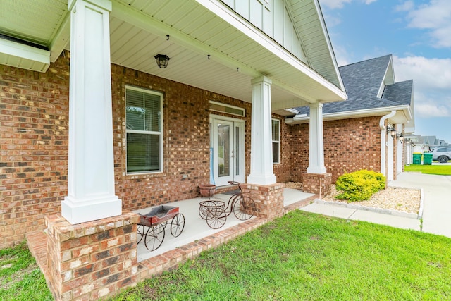 view of exterior entry with a porch