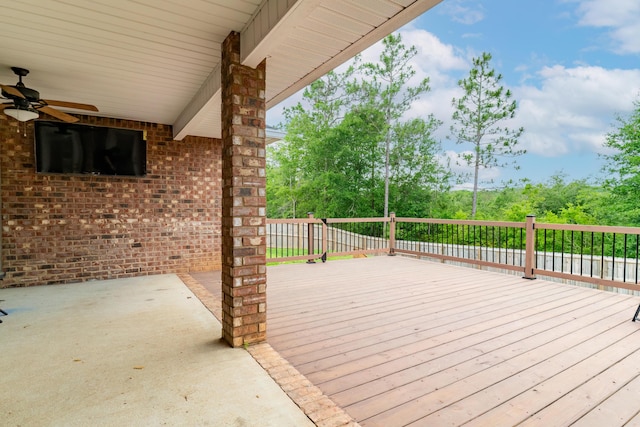 wooden deck featuring ceiling fan