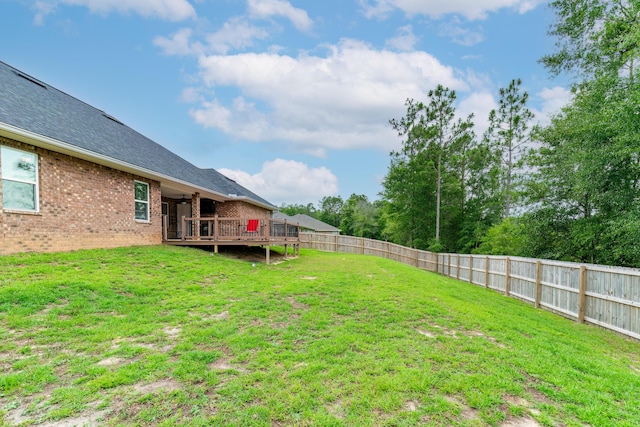 view of yard with a deck