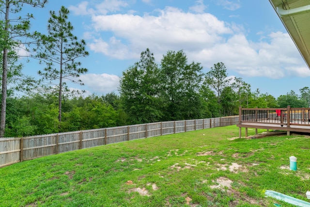 view of yard featuring a wooden deck