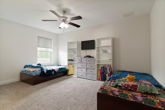 bedroom featuring ceiling fan, a closet, and carpet