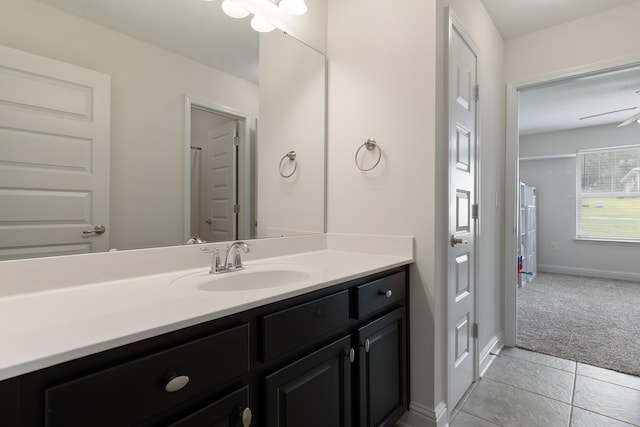 bathroom with ceiling fan, tile patterned floors, and vanity