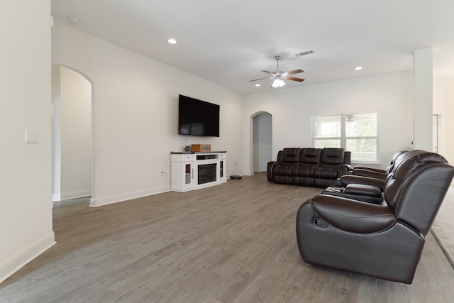 living room featuring hardwood / wood-style flooring and ceiling fan