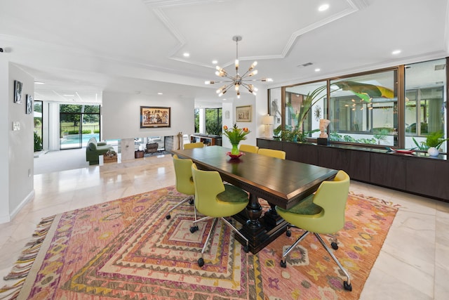 dining room featuring an inviting chandelier, plenty of natural light, and crown molding