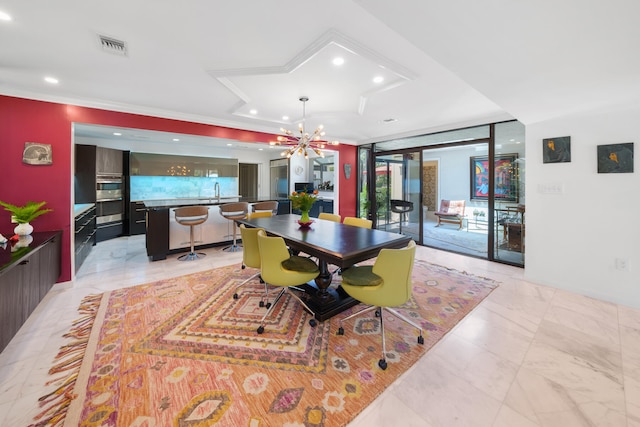 dining space featuring expansive windows, sink, crown molding, and a chandelier