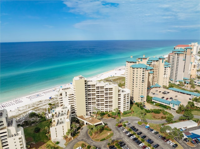 aerial view with a water view and a beach view