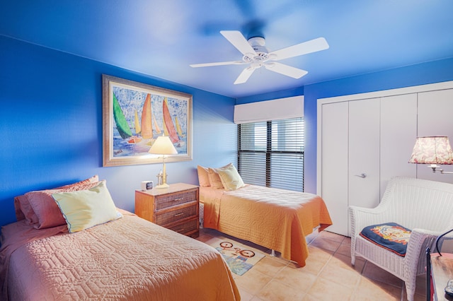 bedroom with ceiling fan and light tile patterned floors