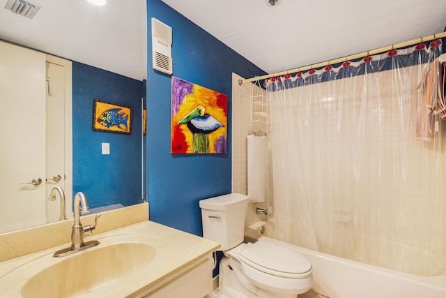 full bathroom with shower / tub combo with curtain, vanity, and toilet