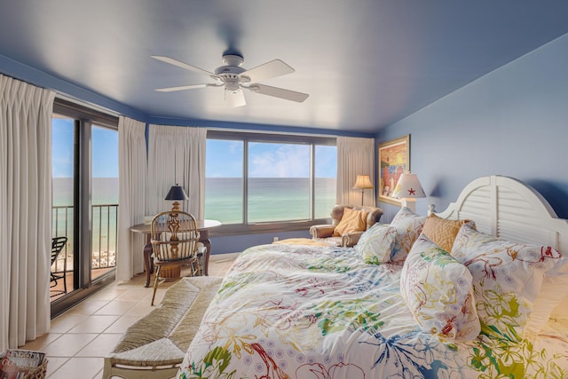 bedroom with access to exterior, light tile patterned floors, a water view, and ceiling fan