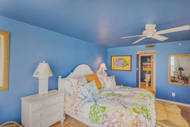 tiled bedroom featuring ceiling fan and ensuite bathroom