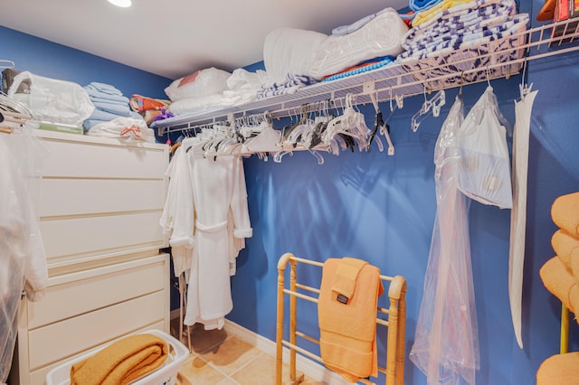 walk in closet featuring tile patterned flooring