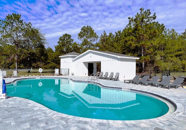 view of pool featuring a patio