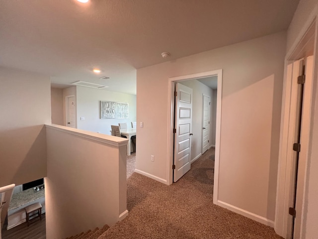 hallway with carpet