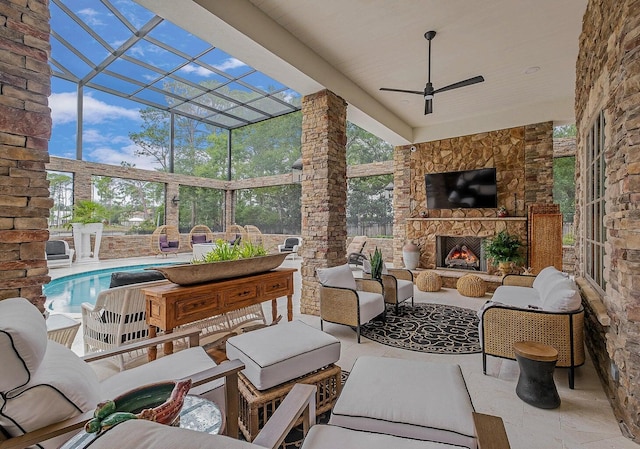 view of patio / terrace with a ceiling fan, glass enclosure, an outdoor pool, and an outdoor living space with a fireplace