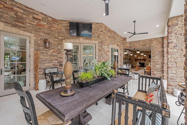 view of patio / terrace featuring a ceiling fan and french doors