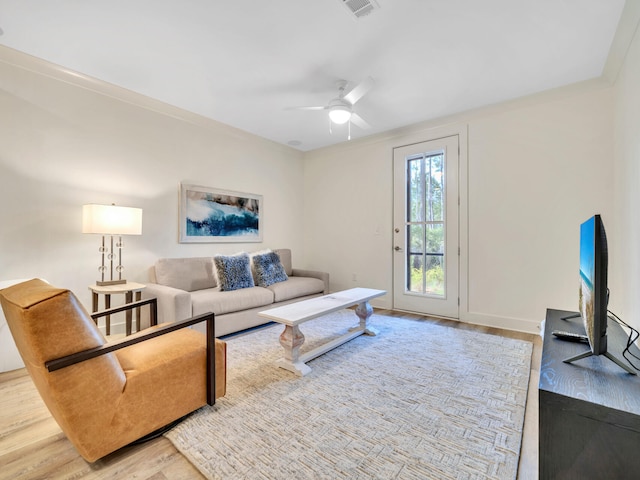 living room featuring ceiling fan and light hardwood / wood-style floors