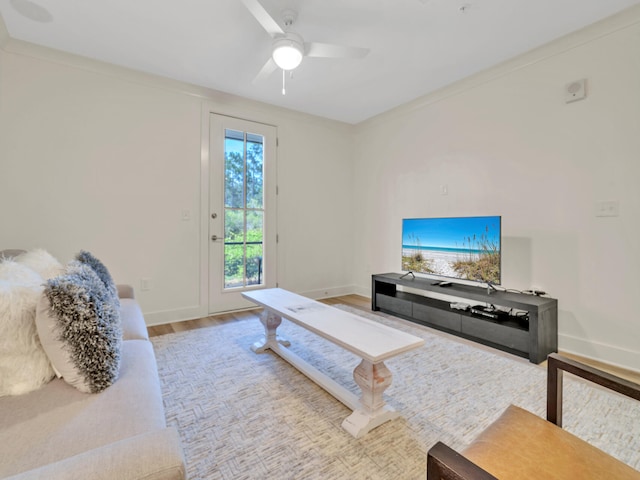 living room with hardwood / wood-style flooring and ceiling fan