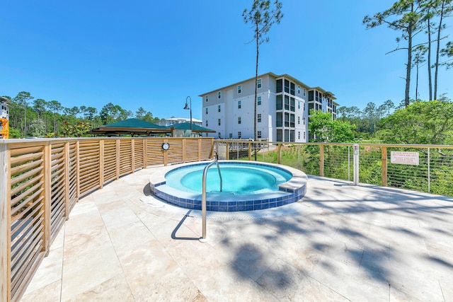 view of pool featuring a community hot tub