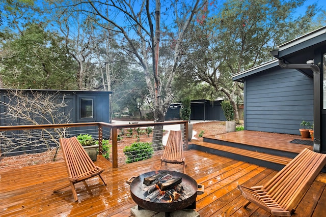 deck featuring an outdoor fire pit