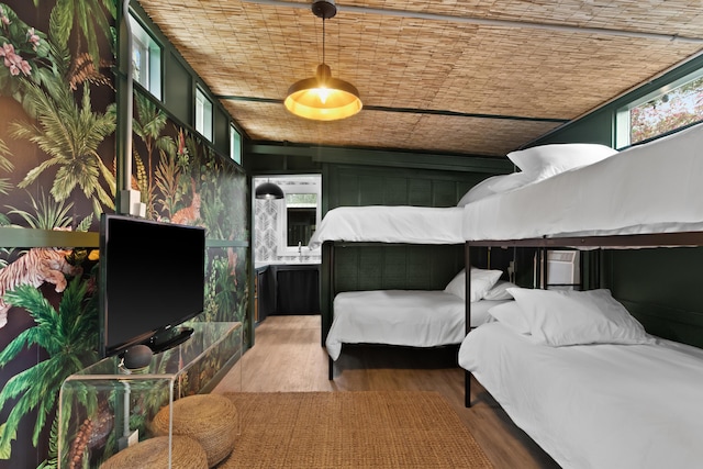 bedroom with hardwood / wood-style floors and wooden ceiling