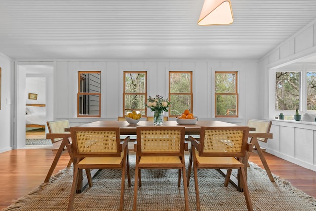 dining room with hardwood / wood-style flooring