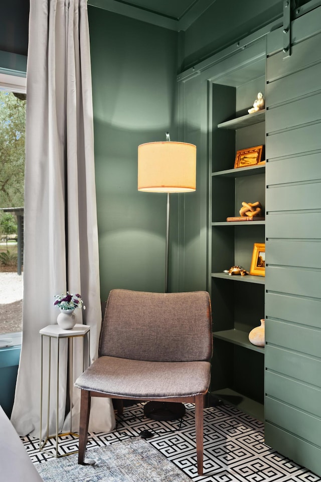 sitting room featuring built in shelves