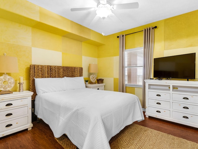 bedroom with ceiling fan and dark hardwood / wood-style flooring