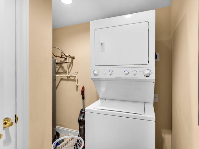 laundry room featuring stacked washer and clothes dryer and hookup for an electric dryer