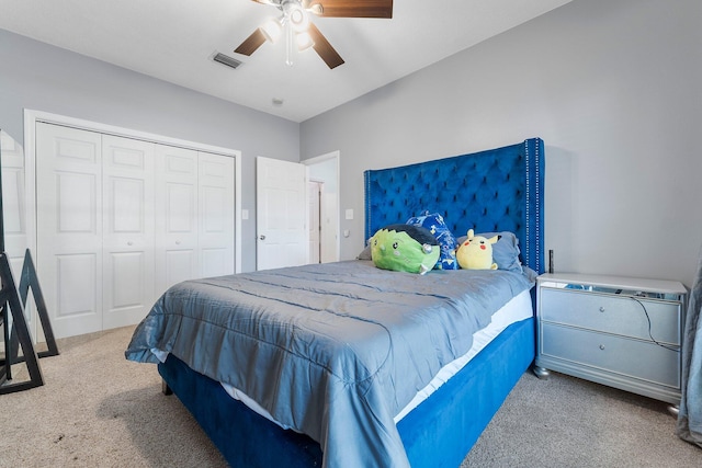 carpeted bedroom with a closet and ceiling fan