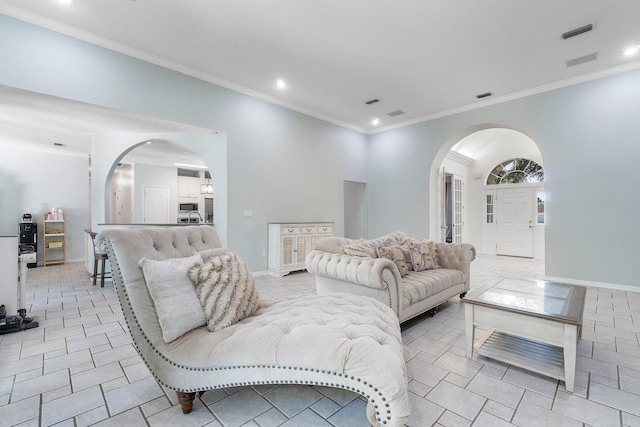 tiled living room featuring crown molding