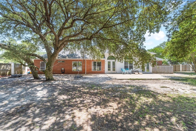 back of property featuring a patio