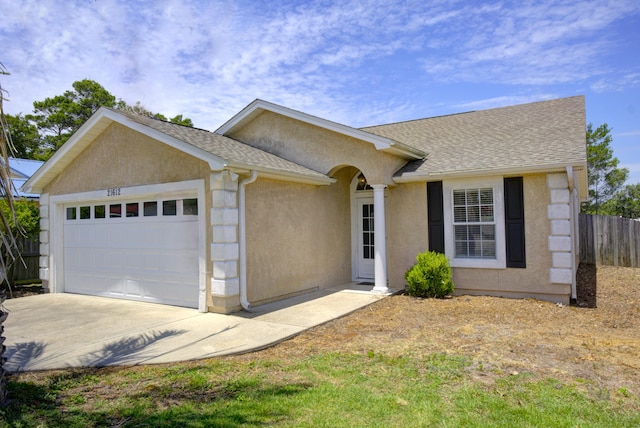 ranch-style house featuring a garage