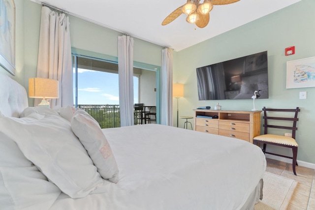 tiled bedroom with access to outside and ceiling fan